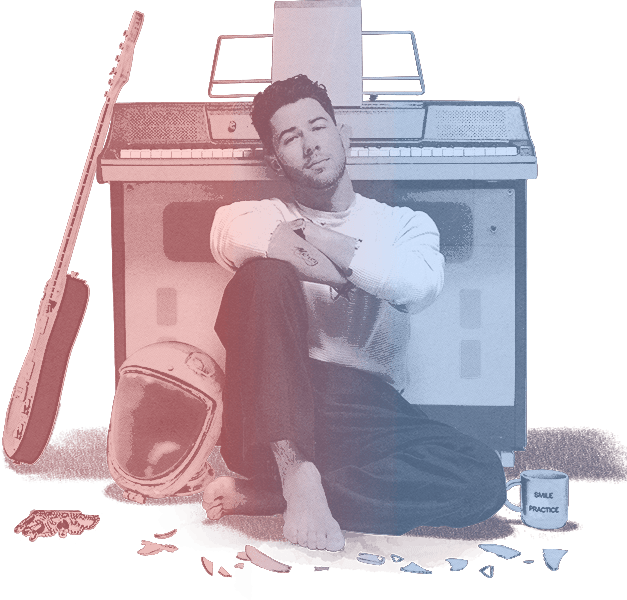 Nick Jonas seated with music equipment